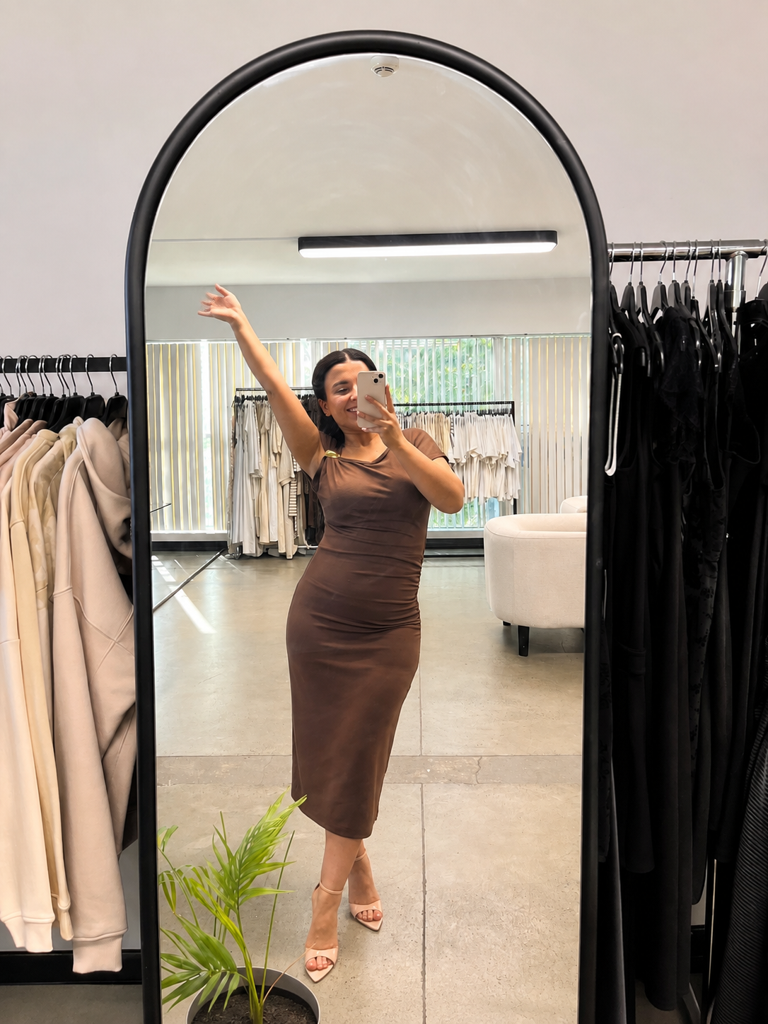 Chic stretch dress with gold buckle detail.